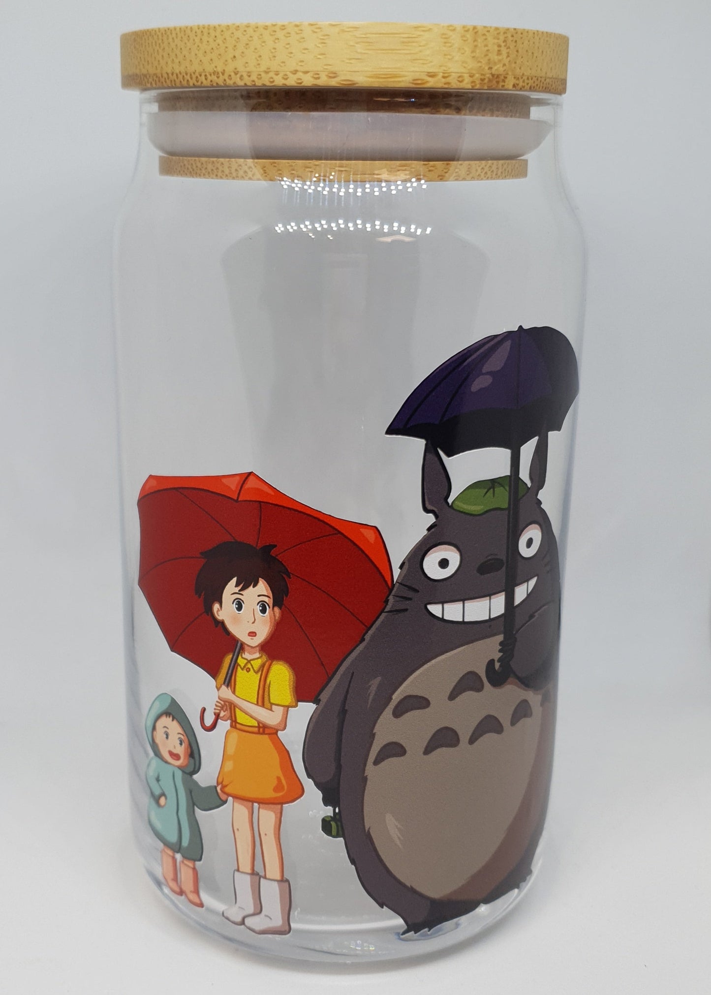 Clear tumbler with cartoon character design on a white background