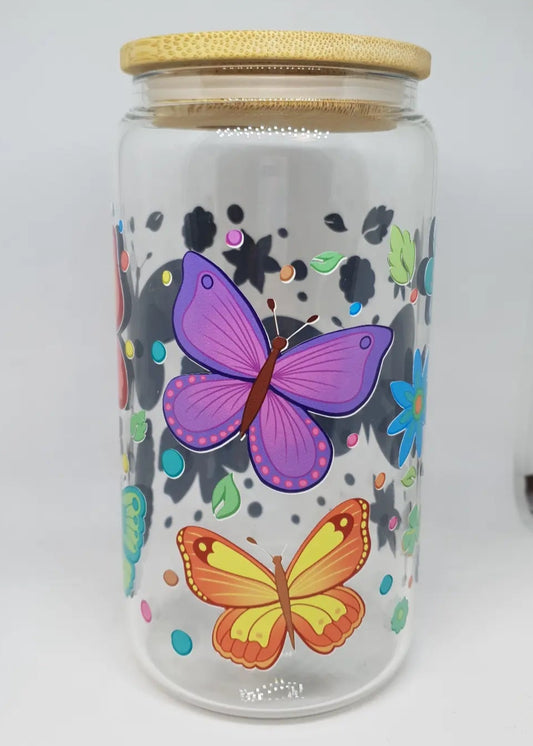 Glass jar with butterfly designs and a wooden lid 