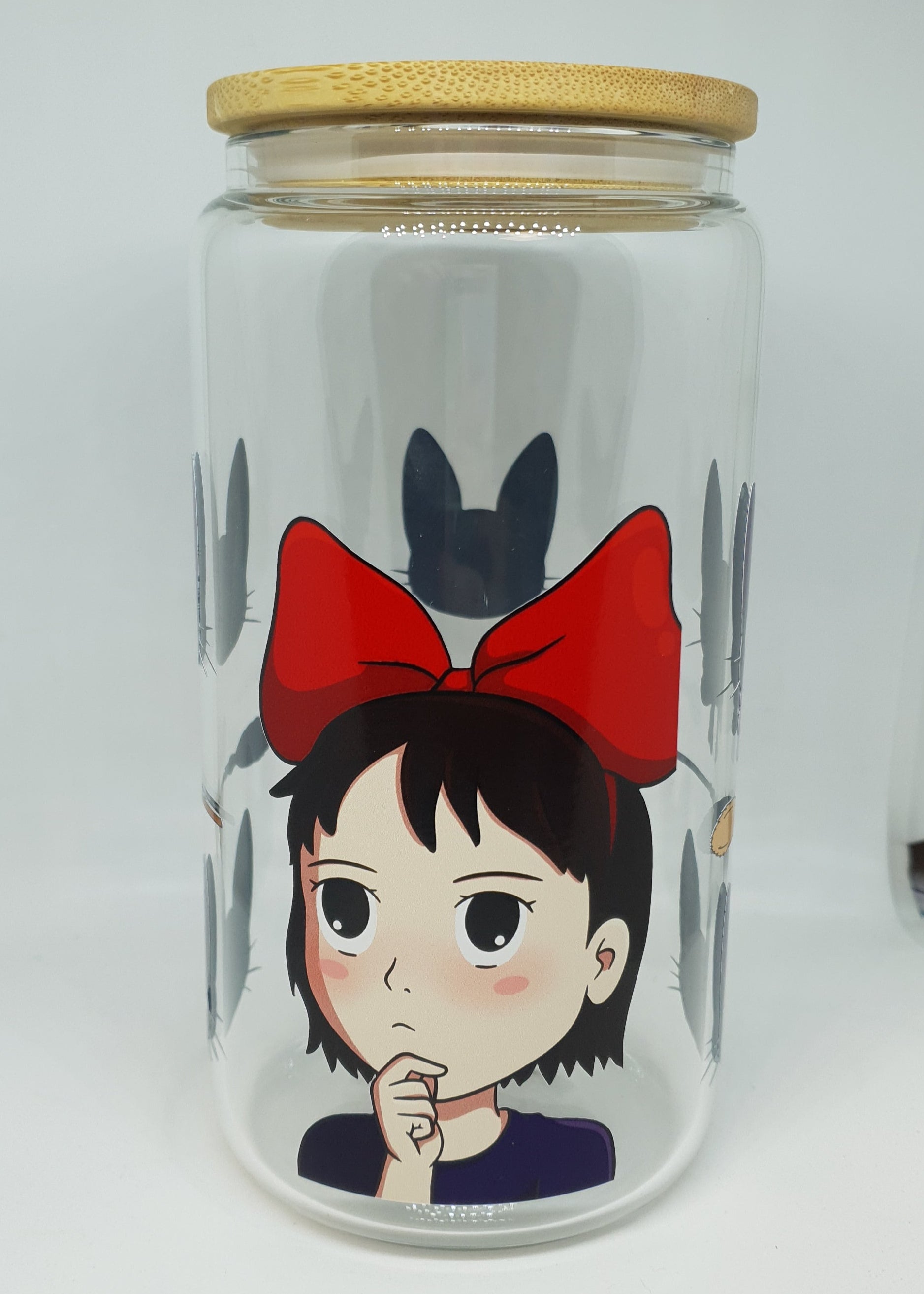 Clear glass bottle with cartoon character on a white background