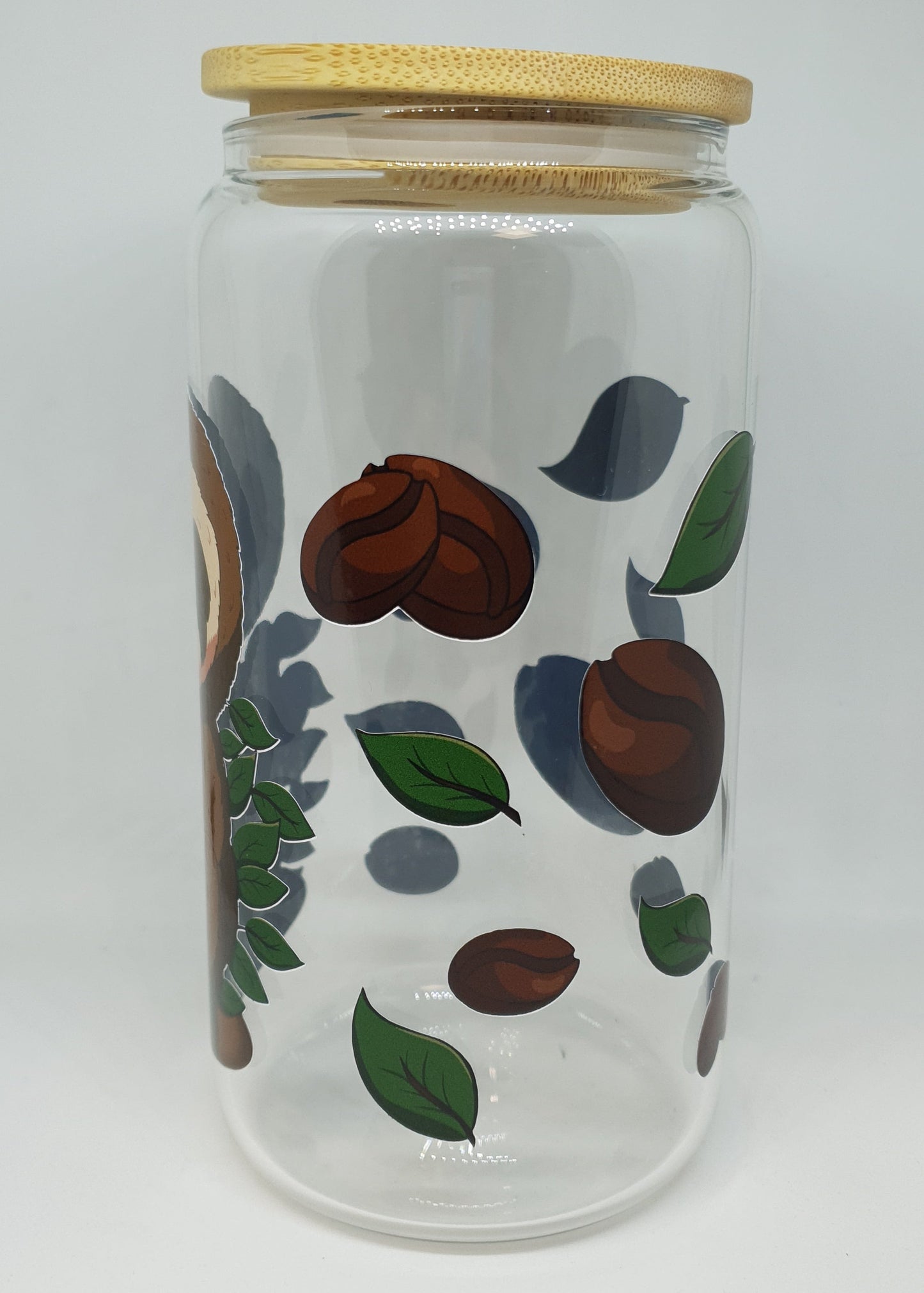Glass jar with wooden lid featuring coffee bean and leaf design on a white background