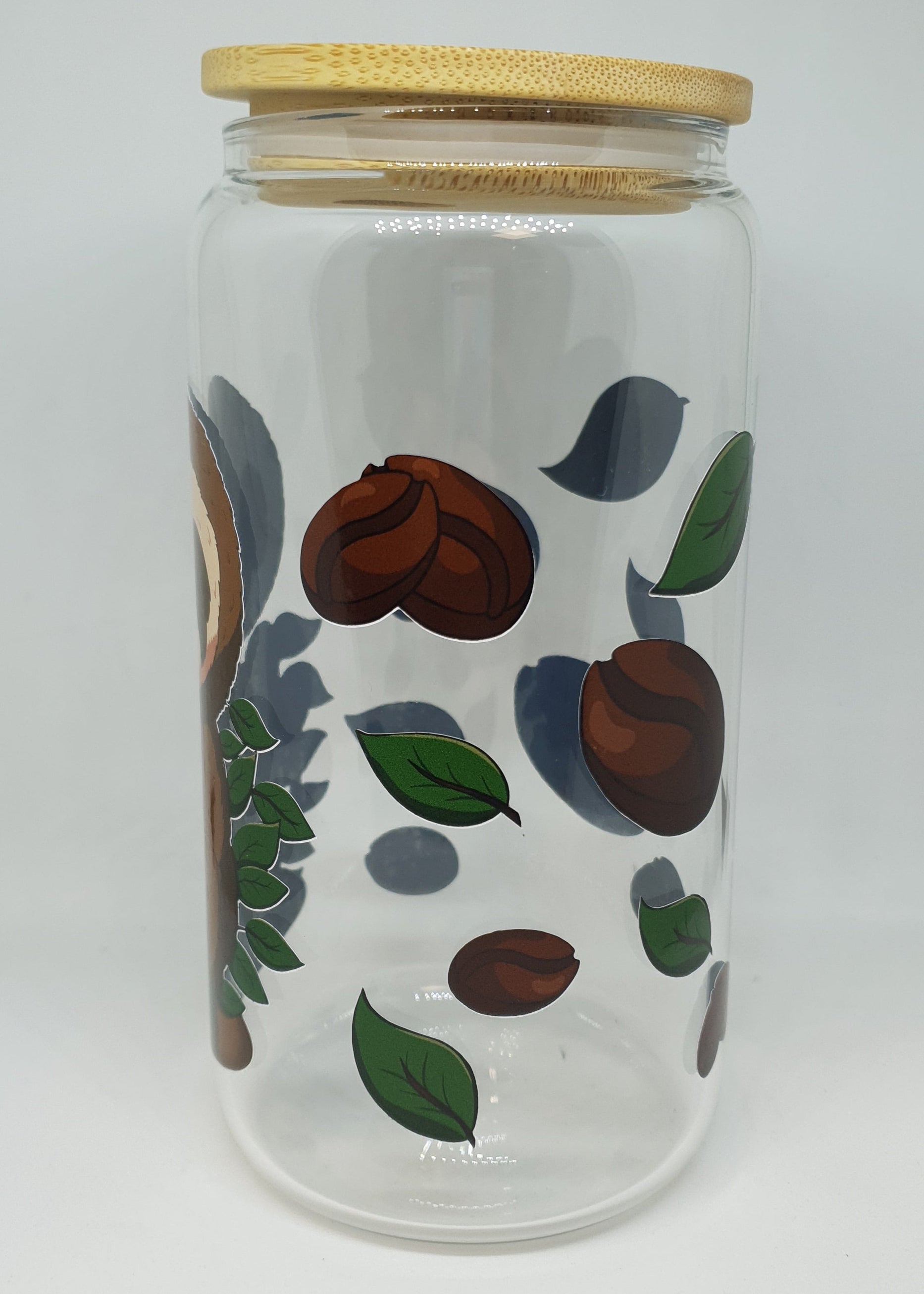 Glass jar with wooden lid featuring coffee bean and leaf design on a white background